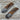 Two folding knives with wooden handles on a wooden surface
