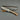 Camping knife with a walnut wood handle and a stainless steel blade, accompanied by a leather sheath and a magnesium fire starter.